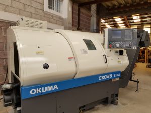 Centro de maquinado Okuma con extractor torno 02